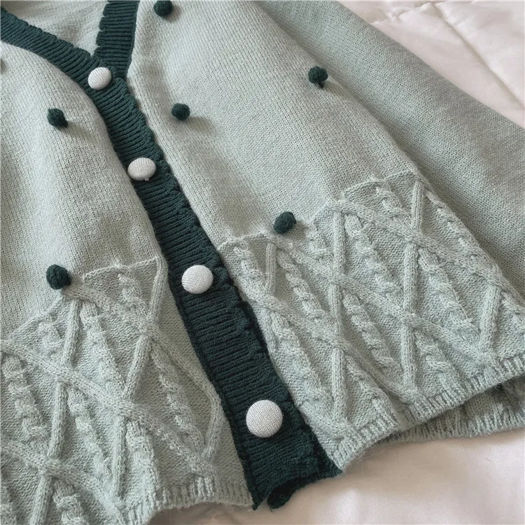 custom-pom-pom-cable-knit-cardigan-v-neck-sweater-hem-details