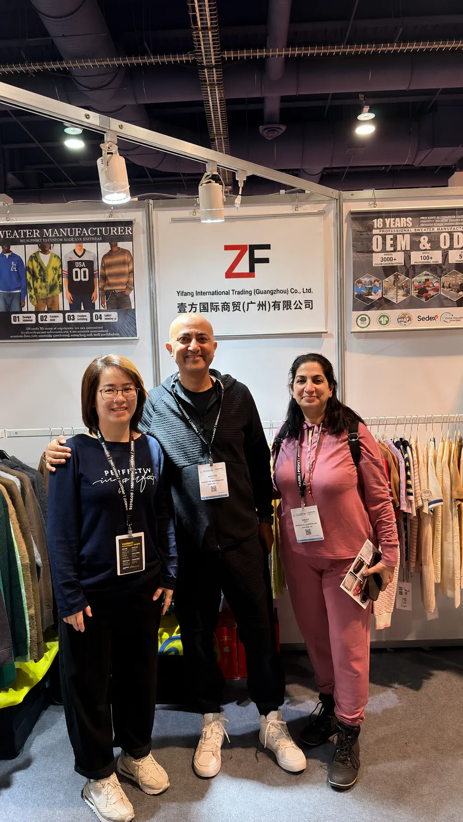 Overseas clients meeting with OEM knitwear manufacturer at international apparel trade fair