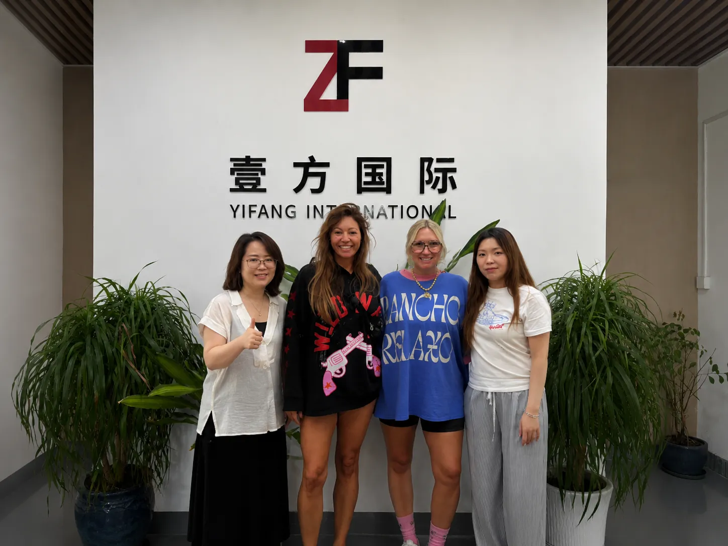 American fashion brand partners visiting Yifang International knitwear factory Guangzhou China