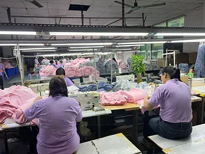 Skilled workers performing garment processing and assembly in China Sweater Manufacturer 